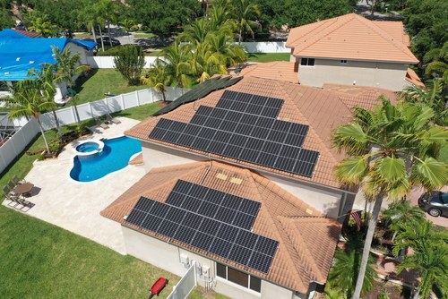solar panels installed on house with pool