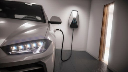 Electric car charging station installed in home garage